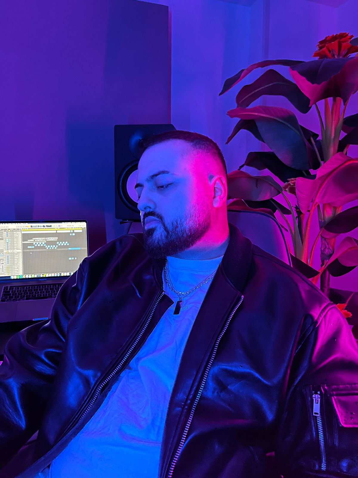 Jawedsway in the studio, a session open in Logic Pro behind him